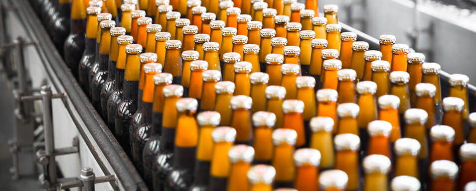 Bottled beverages in brown bottles with silver caps