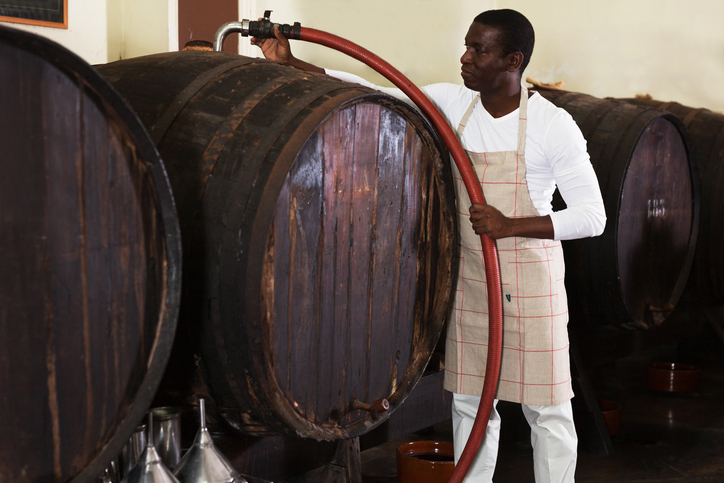 filtering wine in barrels