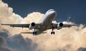Commercial airplane flying through clouds